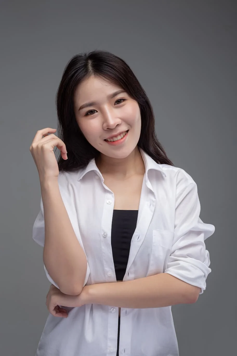 woman-wore-white-shirt-raised-her-right-hand